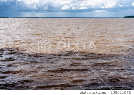 Meeting of the waters of the Negro and Solimoes rivers in the city of Manaus in Amazonia, Brazil Meeting of the waters of the Negro and Solimoes rivers in the city of Manaus in Amazonia, Brazil 139611078