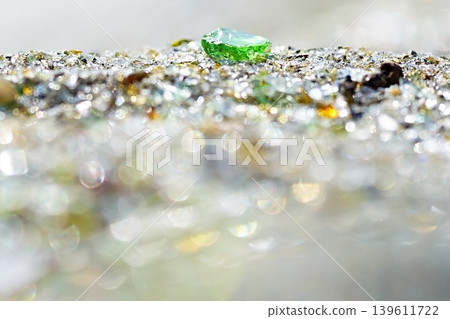 A fantastical macro background with shimmering green glass fragments. A fantastical macro background with shimmering green glass fragments. 139611722