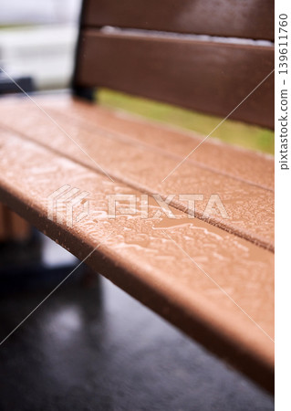Detailed texture of water droplets on a brown wooden surface, abstract nature background with bokeh Detailed texture of water droplets on a brown wooden surface, abstract nature background with bokeh 139611760
