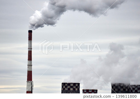 Thermal power plant with cooling towers and smoke pollution Thermal power plant with cooling towers and smoke pollution 139611800