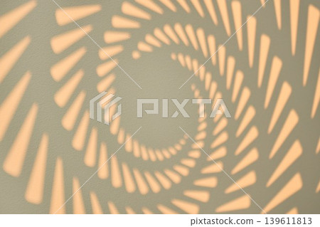 Minimalist background: geometric sun rays shadow in a vortex shape Minimalist background: geometric sun rays shadow in a vortex shape 139611813