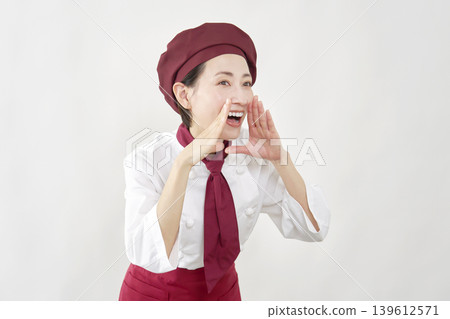 Female pastry chef calling out, white background, facing right. Female pastry chef calling out, white background, facing right. 139612571