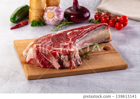 Raw prime beef steak with bone 139613141