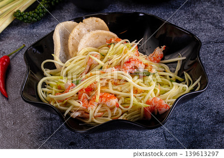 Asian salad with mango and prawn Asian salad with mango and prawn 139613297