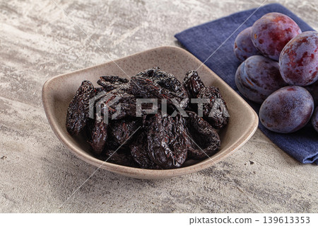 Black dry sweet prunes heap Black dry sweet prunes heap 139613353