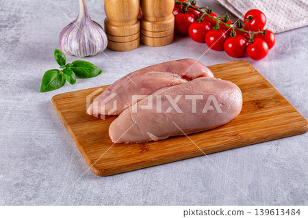 Fresh raw chicken breast over board Fresh raw chicken breast over board 139613484