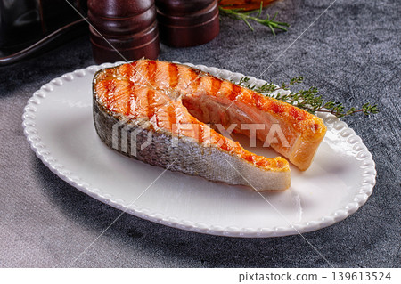 Grilled salmon steak served thyme Grilled salmon steak served thyme 139613524