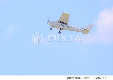 A propeller plane that has just taken off. A propeller plane that has just taken off. 139613592