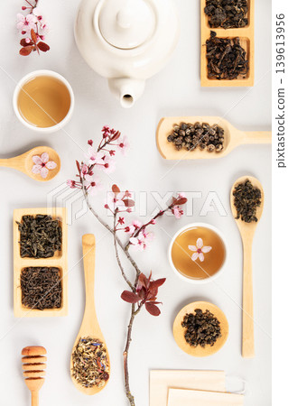 Tea Flat Lay with Teapot, Cups and Loose Tea on White Background Tea Flat Lay with Teapot, Cups and Loose Tea on White Background 139613956