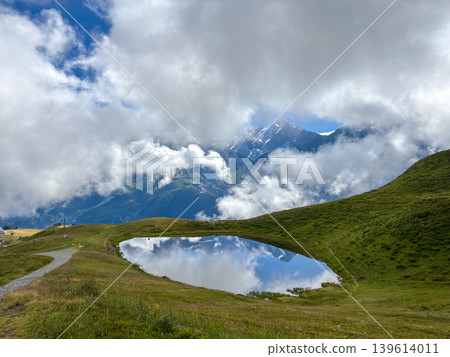 Small mountain lake reflecting Mont Blanc in Les Contamines-Montjoie, France Small mountain lake reflecting Mont Blanc in Les Contamines-Montjoie, France 139614011