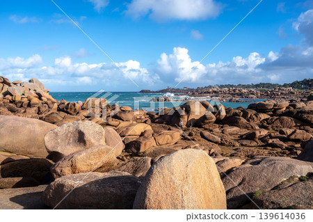 Granite chaos landscape facing Mean Ruz lighthouse in Tregastel, France Granite chaos landscape facing Mean Ruz lighthouse in Tregastel, France 139614036
