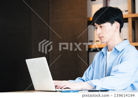 Businessman using a personal computer Businessman using a personal computer 139614194