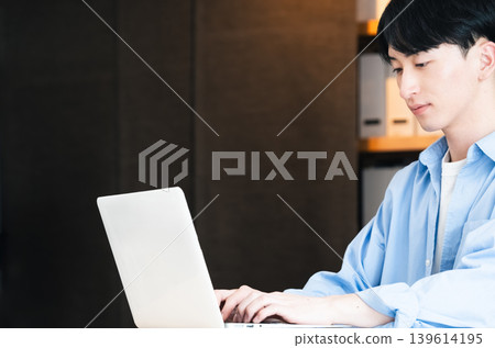 Businessman using a personal computer Businessman using a personal computer 139614195