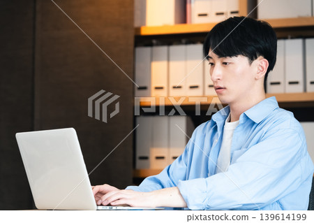 Businessman using a personal computer Businessman using a personal computer 139614199