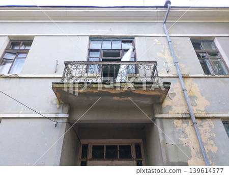 The second-floor balcony is in disrepair The second-floor balcony is in disrepair 139614577