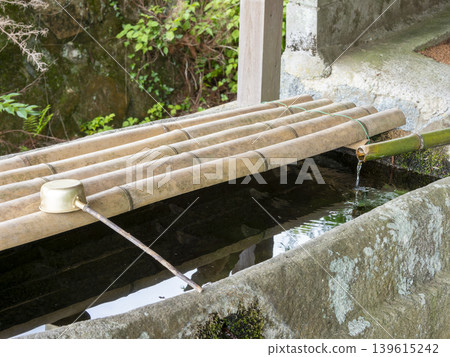 Stone water basin at a shrine Stone water basin at a shrine 139615242