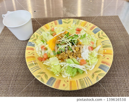 Taco rice served with a soup cup 139616538