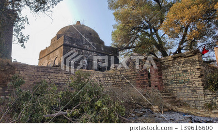 Historic Guru Nanak monument surrounded by stone ruins in Pakistan 139616600