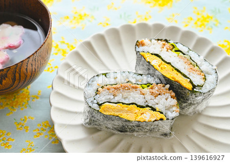 A colorful meal of onigirazu (rice ball sandwiches) and soup. A colorful meal of onigirazu (rice ball sandwiches) and soup. 139616927