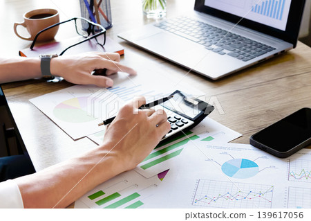 Hands type on calculator Hands type on calculator 139617056