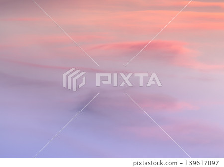 A soft canvas of twilight unfolds, showcasing a serene expanse of wispy clouds bathed in gentle pastel hues. Delicate ribbons of apricot and blush pink seamlessly dissolve into a soothing, A soft canvas of twilight unfolds, showcasing a serene expanse of wispy clouds bathed in gentle pastel hues. Delicate ribbons of apricot and blush pink seamlessly dissolve into a soothing, 139617097