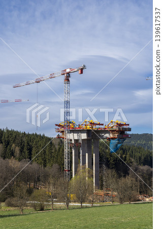Bridge under construction with tower crane in Bernartice Bridge under construction with tower crane in Bernartice 139617537