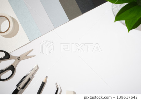 Items for paper craft hobby: scissors, craft knife, pencil, eraser, paper on wthite background. Space for your text. Items for paper craft hobby: scissors, craft knife, pencil, eraser, paper on wthite background. Space for your text. 139617642