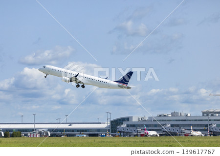 Passenger airplane taking off from airport runway Passenger airplane taking off from airport runway 139617767