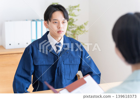 Businessmen in work clothes having a meeting Businessmen in work clothes having a meeting 139618373