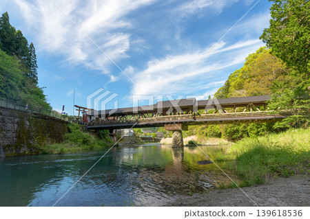 The beautiful wooden bridge of Mishima Shrine, spanning the Yusuhara River. The beautiful wooden bridge of Mishima Shrine, spanning the Yusuhara River. 139618536