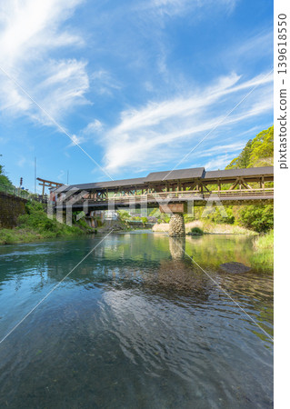 The beautiful wooden bridge of Mishima Shrine, spanning the Yusuhara River. The beautiful wooden bridge of Mishima Shrine, spanning the Yusuhara River. 139618550