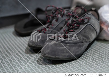 Close-up of a climbing shoe used for indoor and outdoor rock climbing. Specialized footwear designed for optimal grip, precision, and support on climbing holds. Close-up of a climbing shoe used for indoor and outdoor rock climbing. Specialized footwear designed for optimal grip, precision, and support on climbing holds. 139618694