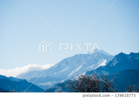 Snowy mountains at winter sunny day. Snowy mountains at winter sunny day. 139618773