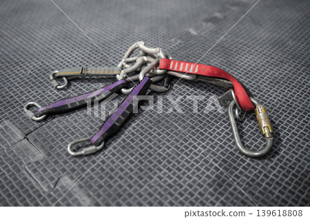 Several quickdraws and carabiners used in rock climbing and mountaineering. Professional climbing equipment designed for rope clipping, protection, and safety during lead climbing and outdoor 139618808