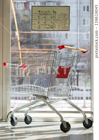 Vertical shot of an Empty cart in a supermarket Vertical shot of an Empty cart in a supermarket 139619045