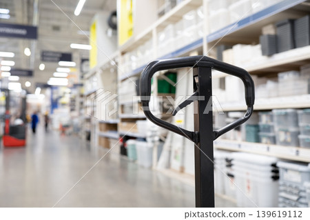 Warehouse equipment for cargo handling concept . Hand pallet truck close up view . Warehouse equipment for cargo handling concept . Hand pallet truck close up view . 139619112