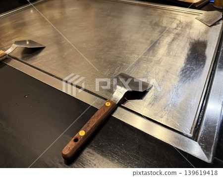 Griddle at an okonomiyaki restaurant Griddle at an okonomiyaki restaurant 139619418