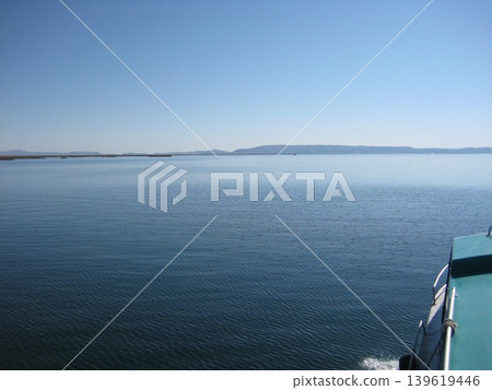 Lake Titicaca in tranquility, viewed from a boat. Lake Titicaca in tranquility, viewed from a boat. 139619446