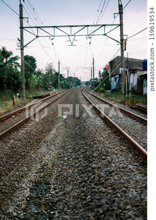Straight railway tracks on Indonesian commuter rail network Straight railway tracks on Indonesian commuter rail network 139619534