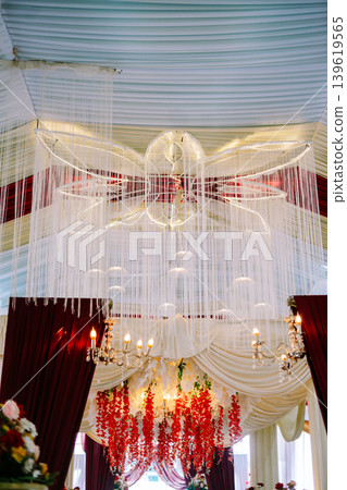 Stylish Wedding Tent Interior with Hanging Decorative Lights Stylish Wedding Tent Interior with Hanging Decorative Lights 139619565