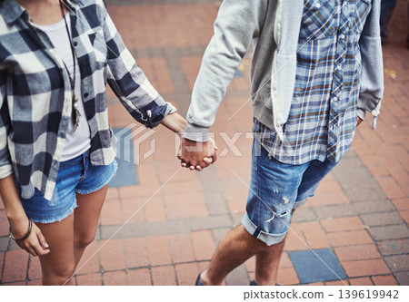 Love, walking and couple holding hands on relax journey, morning trip or weekend tour for outdoor adventure. Fashion, casual clothes and romantic people commute on street, road or sidewalk floor Love, walking and couple holding hands on relax journey, morning trip or weekend tour for outdoor adventure. Fashion, casual clothes and romantic people commute on street, road or sidewalk floor 139619942
