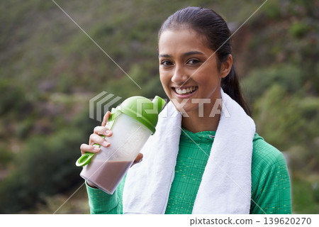 Sports, drink and portrait of woman with protein shake in bottle for health, wellness and energy benefits for exercise. Outdoor, hiking or person with smoothie for nutrition in diet after workout Sports, drink and portrait of woman with protein shake in bottle for health, wellness and energy benefits for exercise. Outdoor, hiking or person with smoothie for nutrition in diet after workout 139620270
