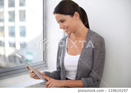 Tablet, smile and business woman research in office on internet, network or scroll on app. Digital technology, typing and creative designer on website, reading email or online notification in startup Tablet, smile and business woman research in office on internet, network or scroll on app. Digital technology, typing and creative designer on website, reading email or online notification in startup 139620297