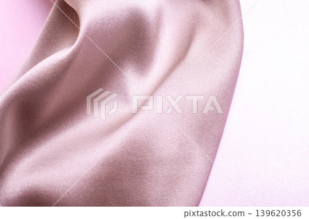Abstract background in soft colors of silk fabrics on pink pearl paper. Beautiful trend texture Abstract background in soft colors of silk fabrics on pink pearl paper. Beautiful trend texture 139620356