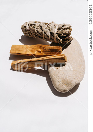 White sage bundle with two palo santo sticks on a white background 139620561