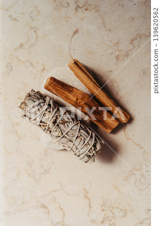 White sage bundle and palo santo sticks on a light marble background White sage bundle and palo santo sticks on a light marble background 139620562