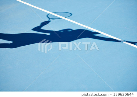 Shadow, tennis and player on outdoor blue court for serving, match or game start in training or competition. Person, athlete or silhouette of ball serve, practice or sports fitness on mockup space Shadow, tennis and player on outdoor blue court for serving, match or game start in training or competition. Person, athlete or silhouette of ball serve, practice or sports fitness on mockup space 139620644