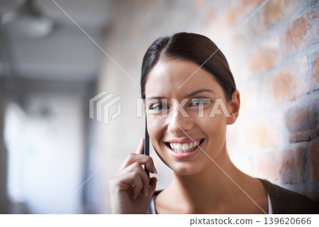 Phone call, portrait or happy woman in workplace for communication, gossip or chat by office wall. Talking, smile or face of designer listening in conversation or speaking of news, feedback or ideas Phone call, portrait or happy woman in workplace for communication, gossip or chat by office wall. Talking, smile or face of designer listening in conversation or speaking of news, feedback or ideas 139620666