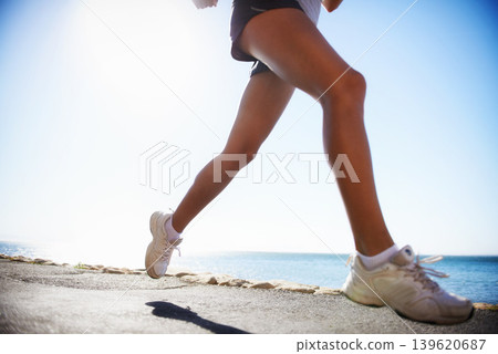 Person, legs and running on road training for marathon practice for healthy cardio, competition or exercise. Athlete, sneakers and jog on street for outdoor physical commitment or speed, path or race Person, legs and running on road training for marathon practice for healthy cardio, competition or exercise. Athlete, sneakers and jog on street for outdoor physical commitment or speed, path or race 139620687