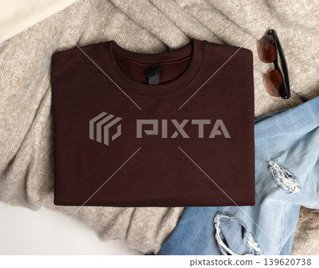 Blank brown unisex sweatshirt mockup, folded crewneck casual flat lay with copy space on front Blank brown unisex sweatshirt mockup, folded crewneck casual flat lay with copy space on front 139620738